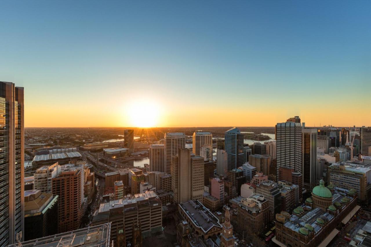 Meriton Suites Pitt Street, Sydney Exterior photo Sunset over the city